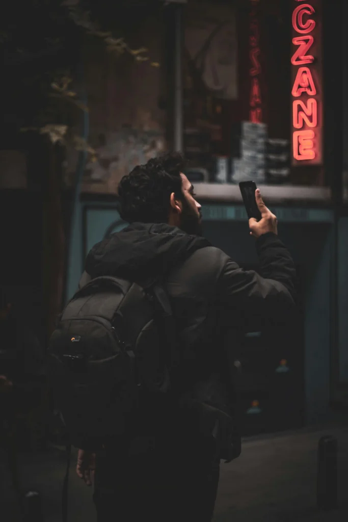 Freelance digital marketer in Kochi analyzing social media trends and online engagement using smartphone