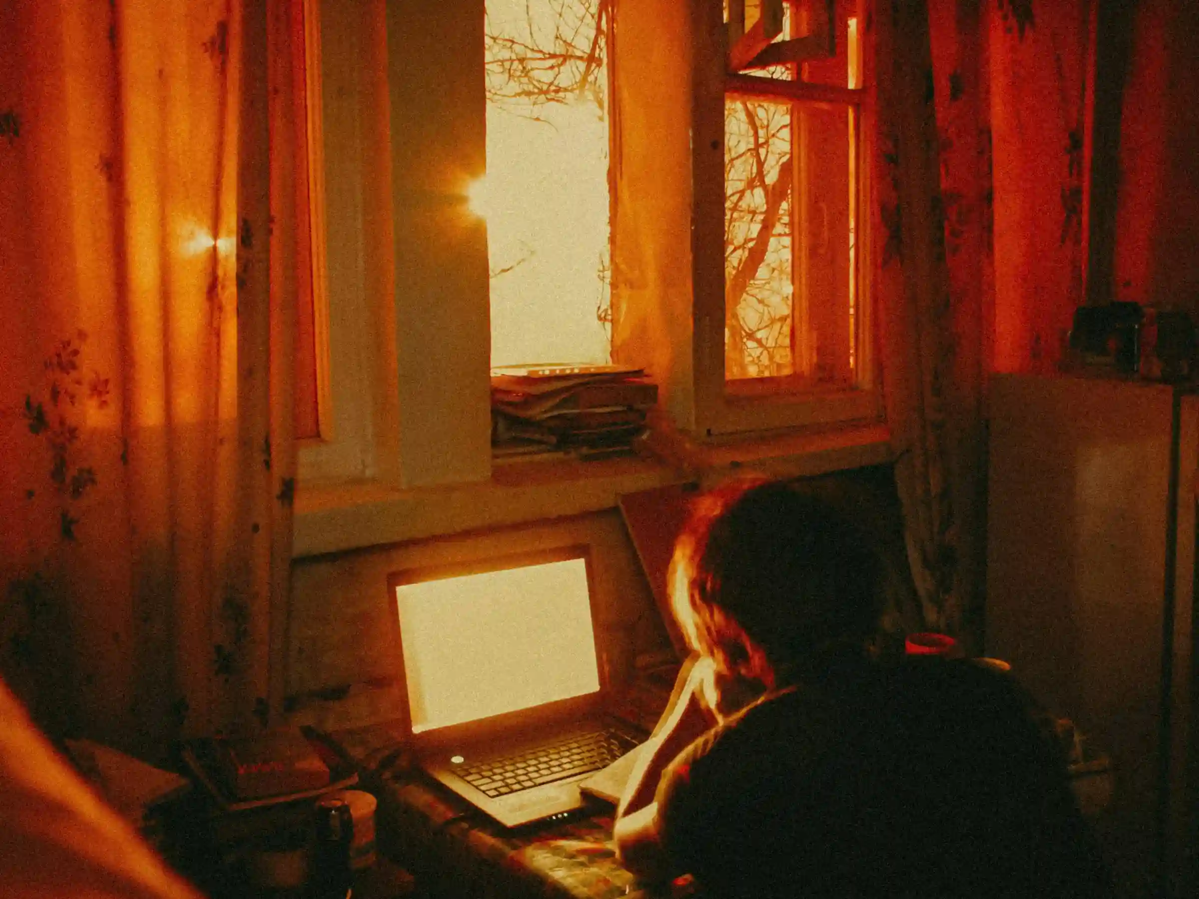 Freelance digital marketer in Kochi working on a laptop during late hours in a home office