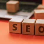 Wooden blocks spelling SEO on a desk representing SEO services by a freelance digital marketer in Kochi